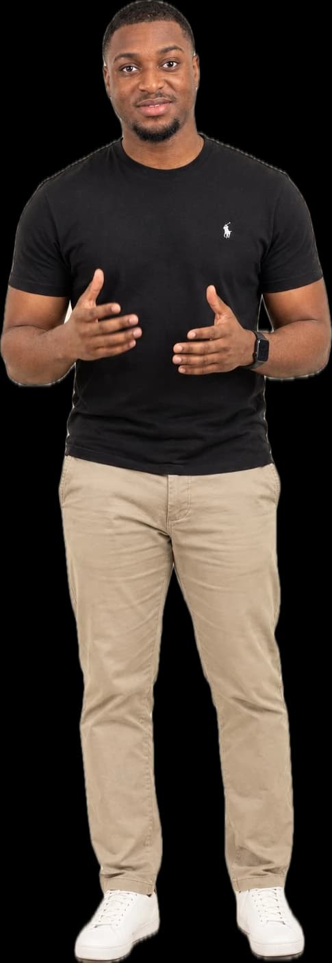 Ebenezer Osei-Bonsu standing in a black T-shirt and khaki trousers, hands open as if explaining something.
